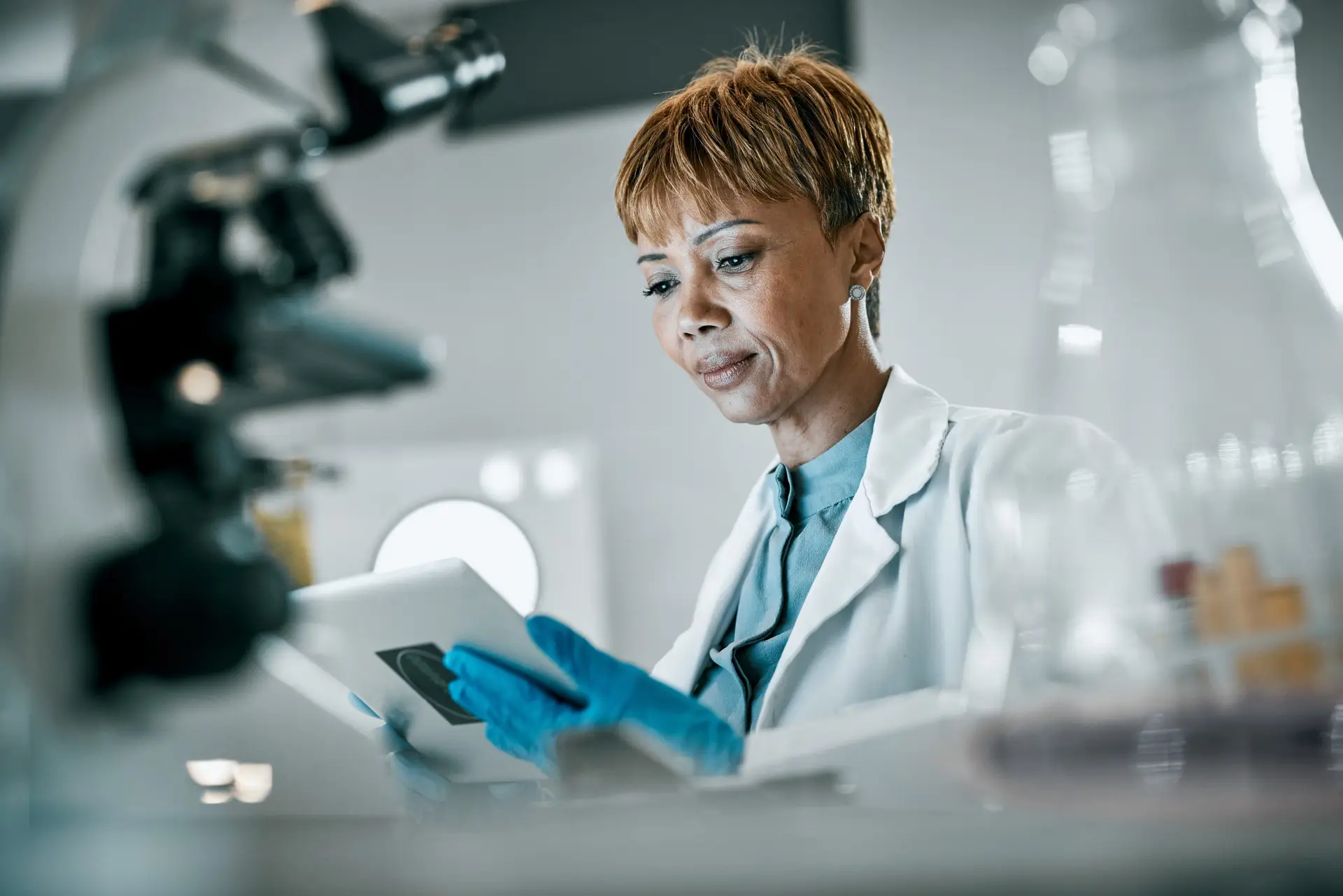 A medical researcher holding a tablet
